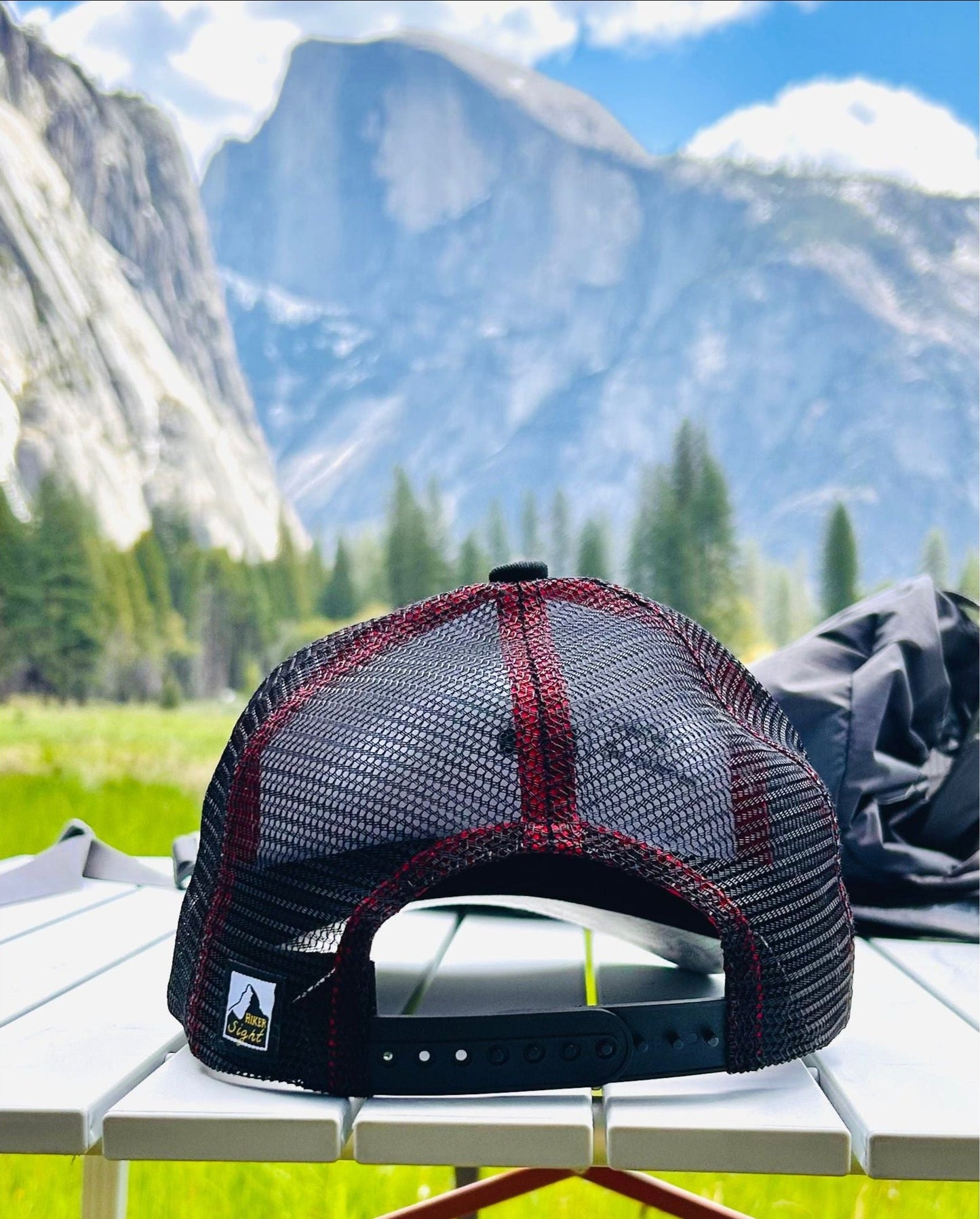 Backside view of Half Dome trucker hat with Half Dome mountain in the background | HikerSight brand