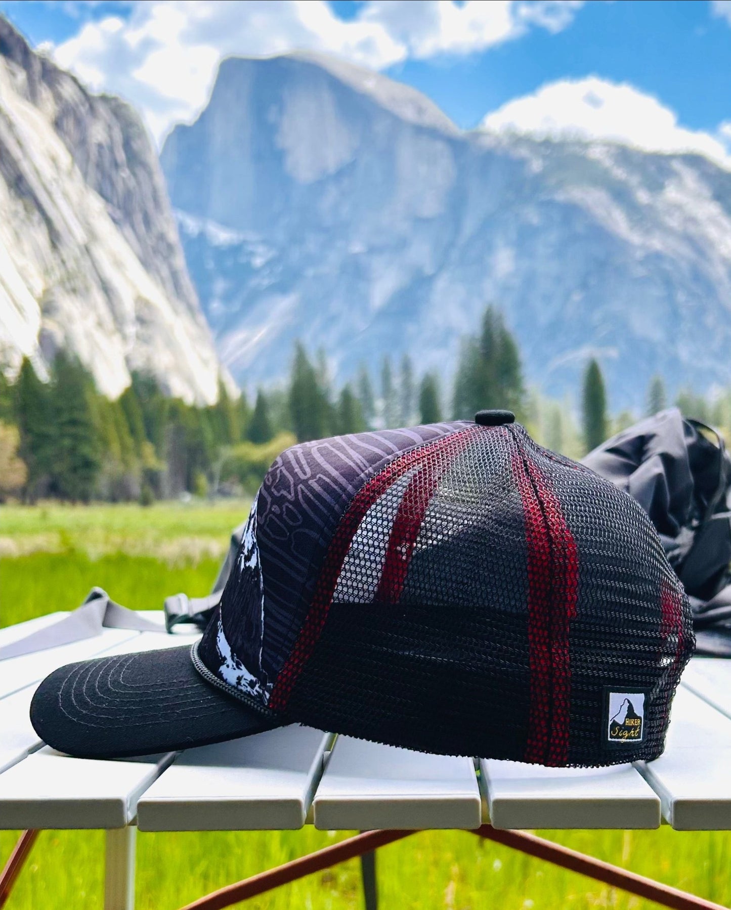 Second side view of Half Dome trucker hat with Half Dome mountain in the background | HikerSight brand